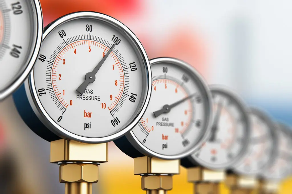 Close-up of pressure gauges measuring different PSI levels.